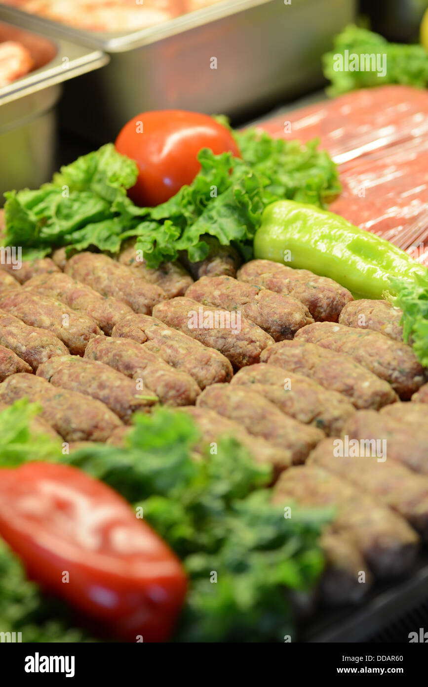 Animal meat products beef cow pork chicken pieces slice portions on diplay Stock Photo