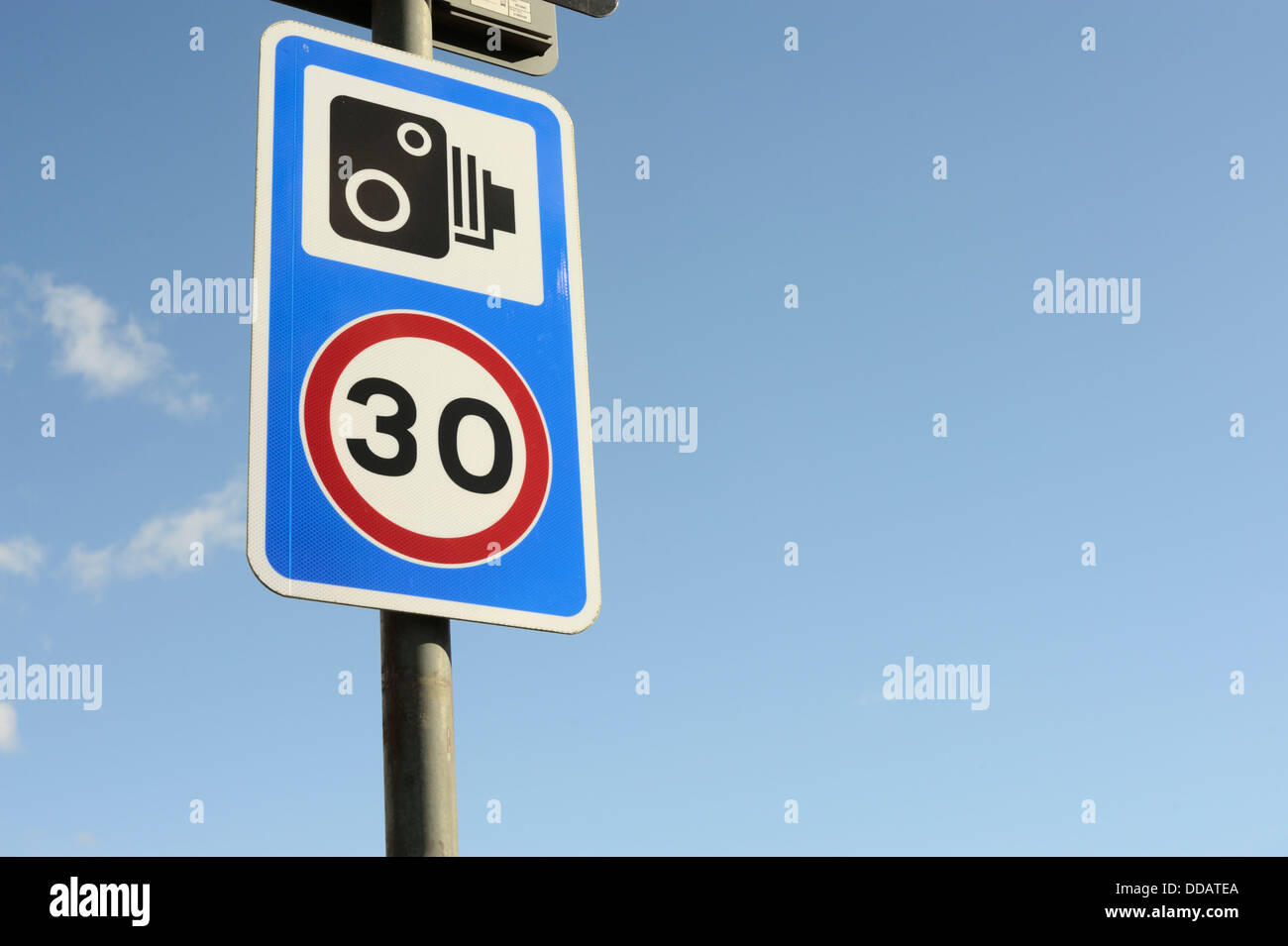 Road speed limit sign with warning of speed camera, Wales, UK Stock Photo