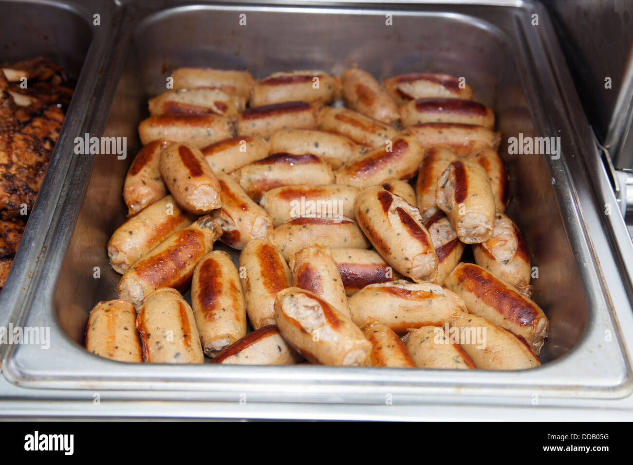 Cooked animal meat products beef cow pork chicken pieces slice portions on diplay Stock Photo