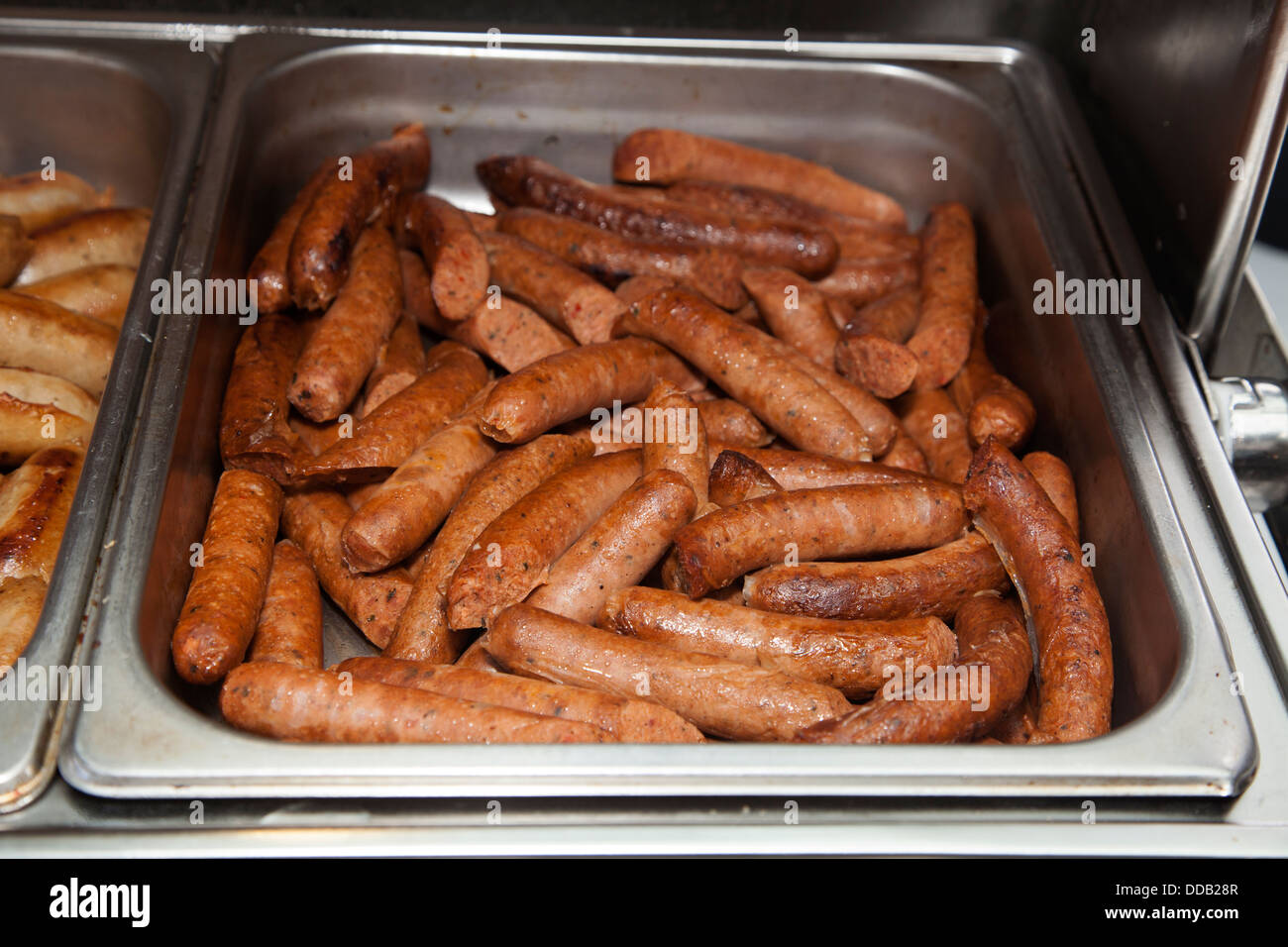 Cooked animal meat products beef cow pork chicken pieces slice portions on diplay Stock Photo