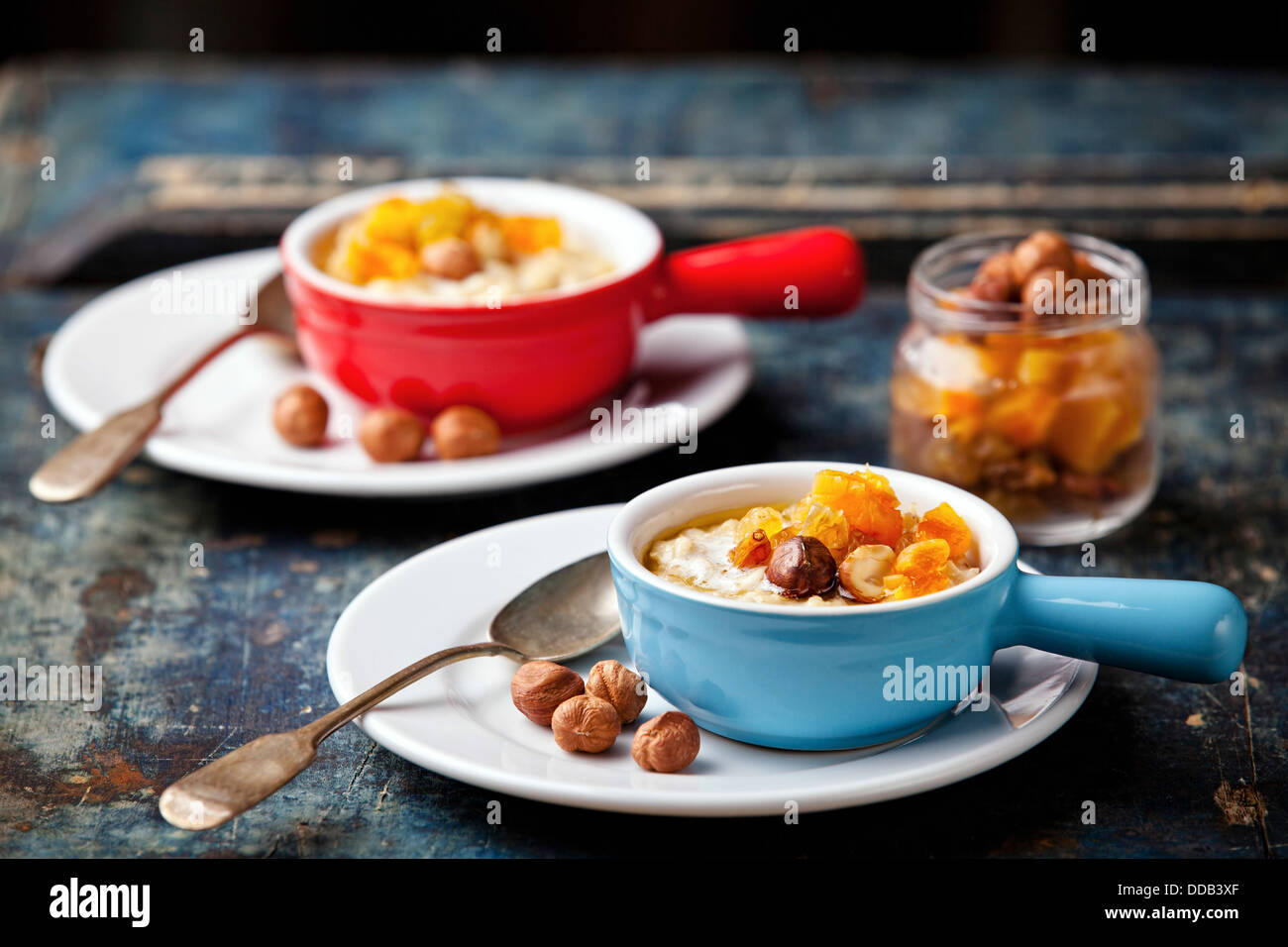 Oatmeal porridge with nuts and dried fruits Stock Photo