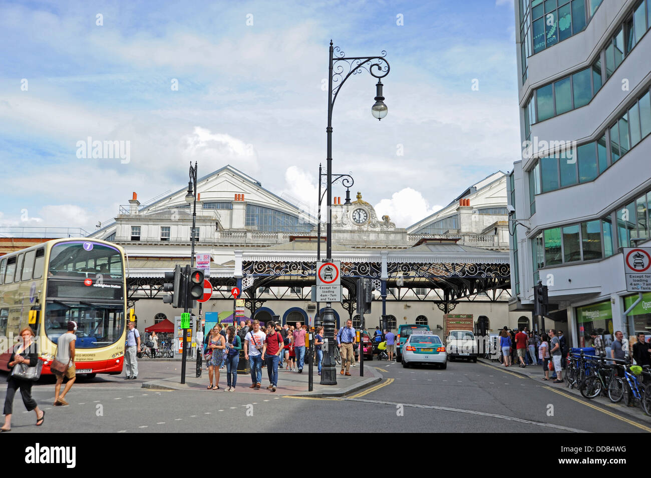 Buses taxis and pedestrians outside Brighton Railway Train Station UK Stock Photo