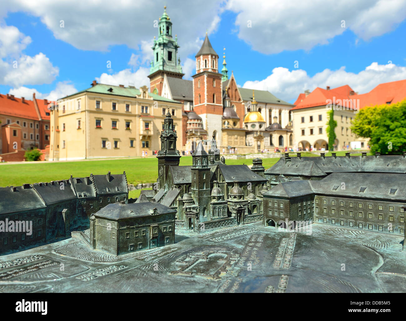 View of a model of the Royal Castle in Krakow with real buildings in the background Stock Photo