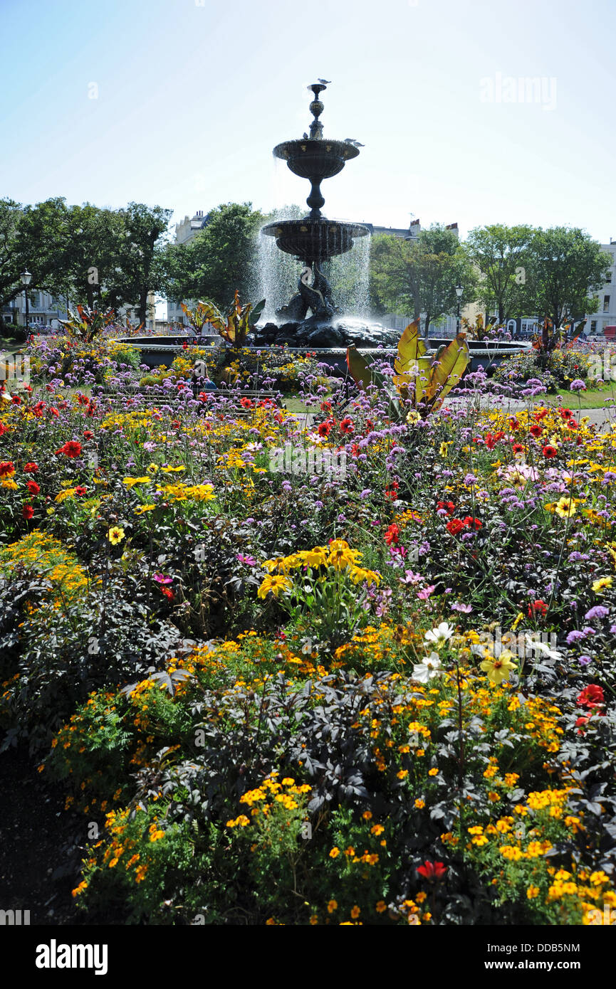 The Old Steine fountain and flower beds  planted by the council in Brighton on a summers day Stock Photo