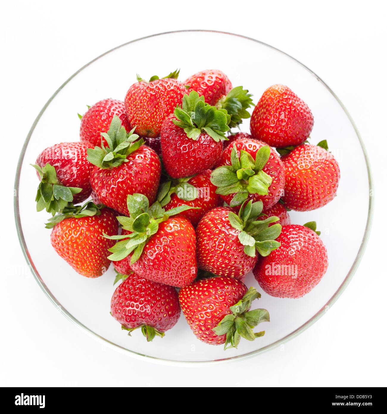 Strawberry in round plate on white background Stock Photo