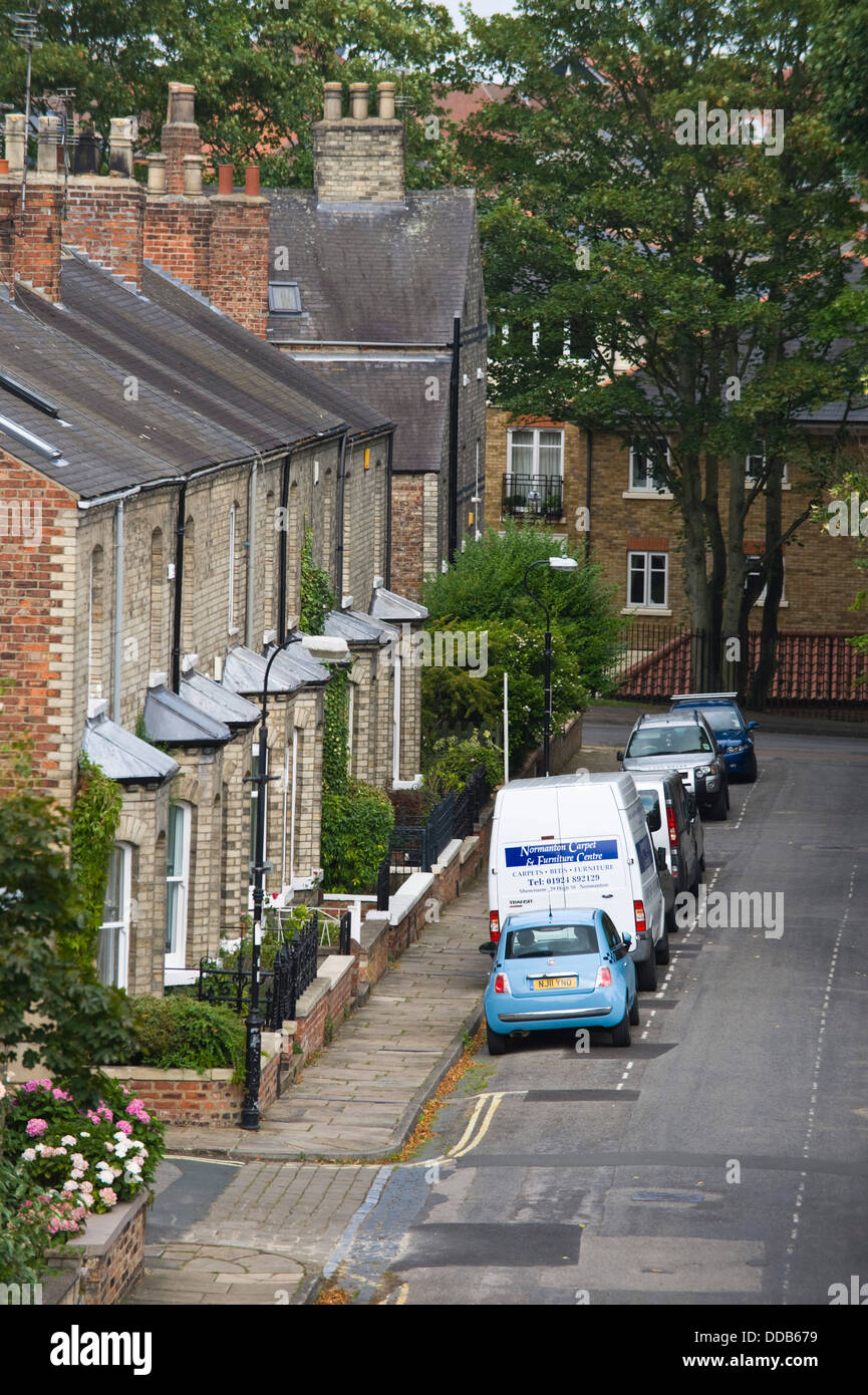 Traditional terraced housing with on street car parking within the city