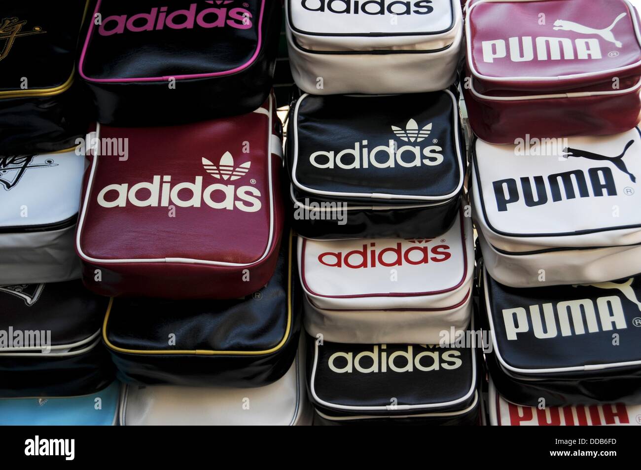 Fake Adidas and Puma sports bags at a market in Bangkok Stock Photo - Alamy