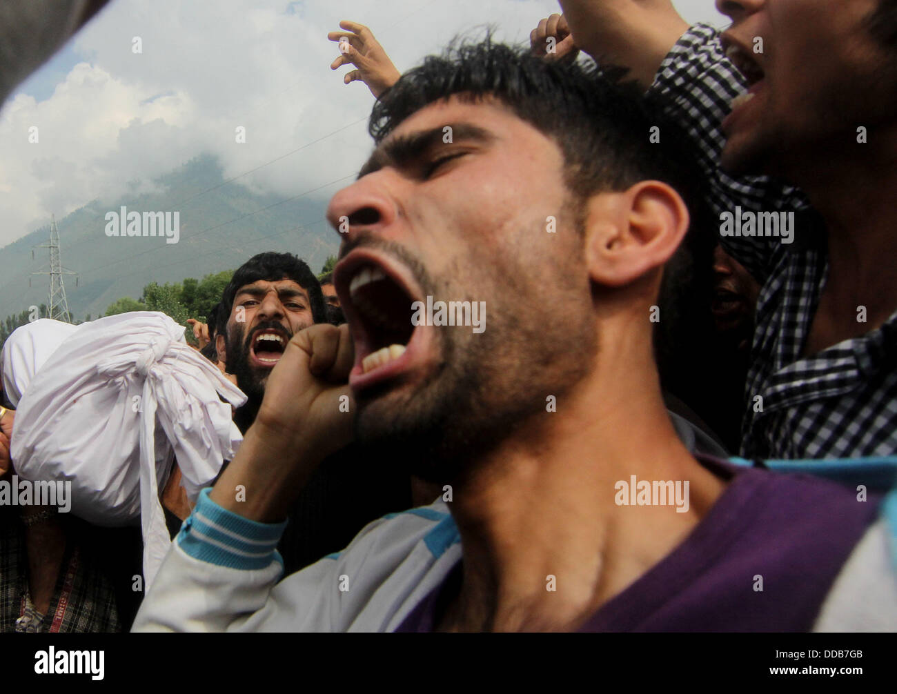 Kashmir, India. 30th Aug, 2013. Kashmiri Muslim villagers shout pro ...