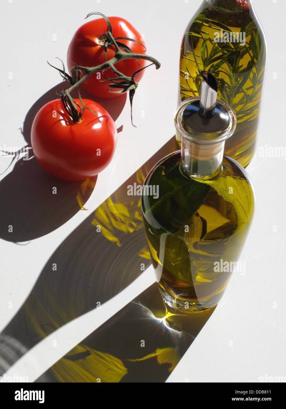 Olive oil flavored with bay leaves, rosemary Stock Photo Alamy