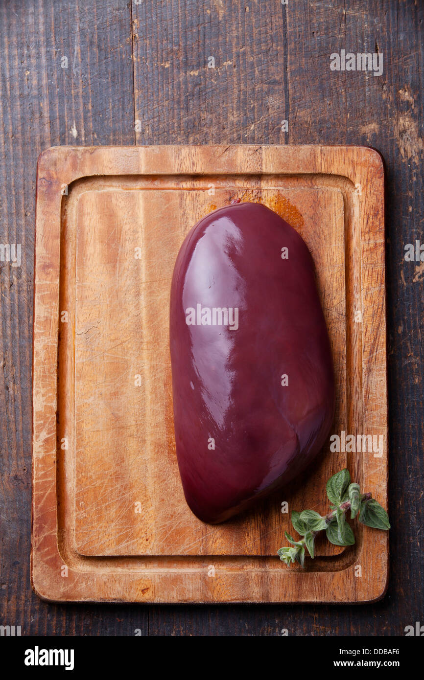 Raw liver on Chopping board Stock Photo