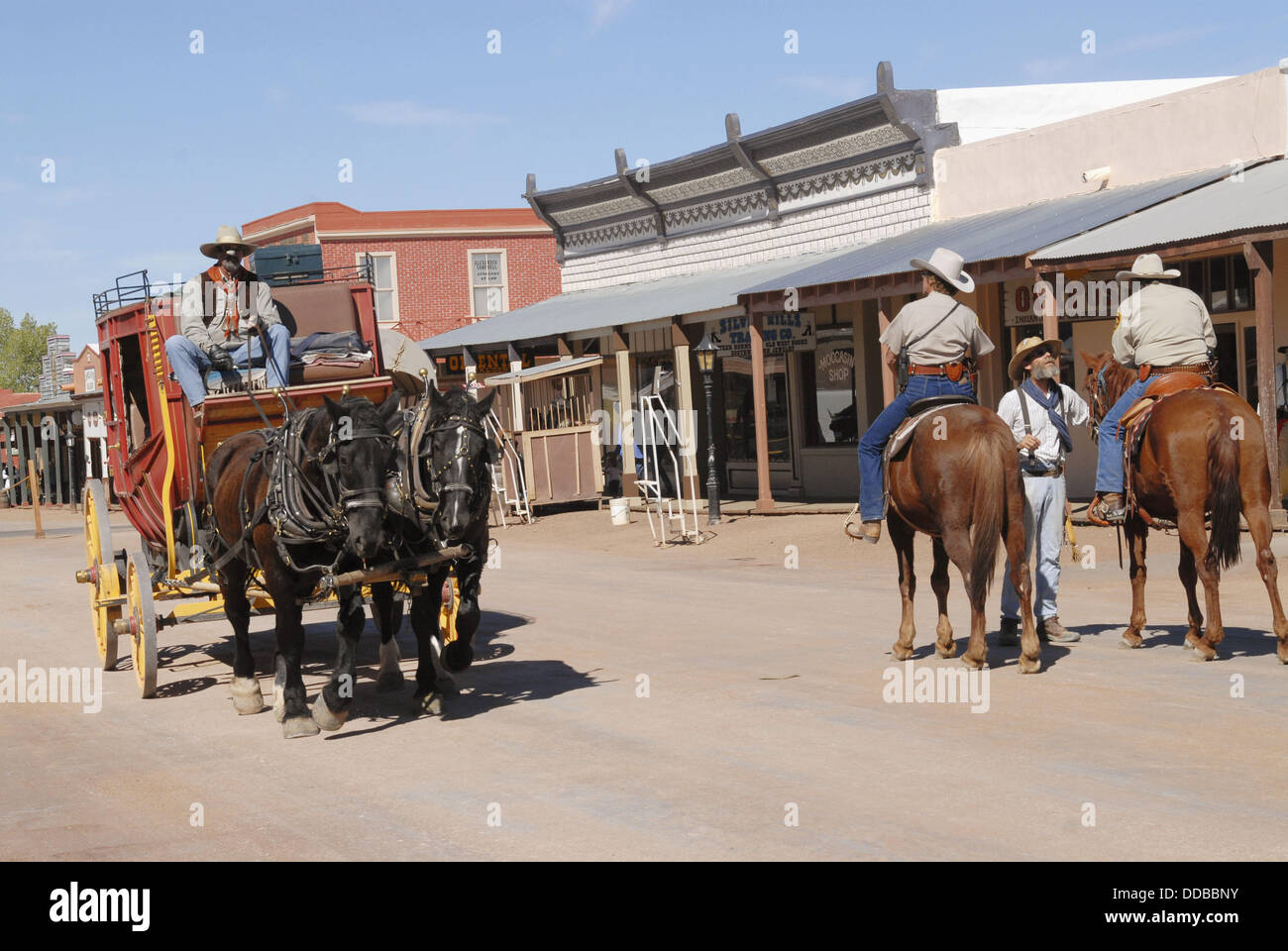 Couple of Horse Riders and Wagon Pulled By Horses, Tombstone, Arizona, United States Stock Photo