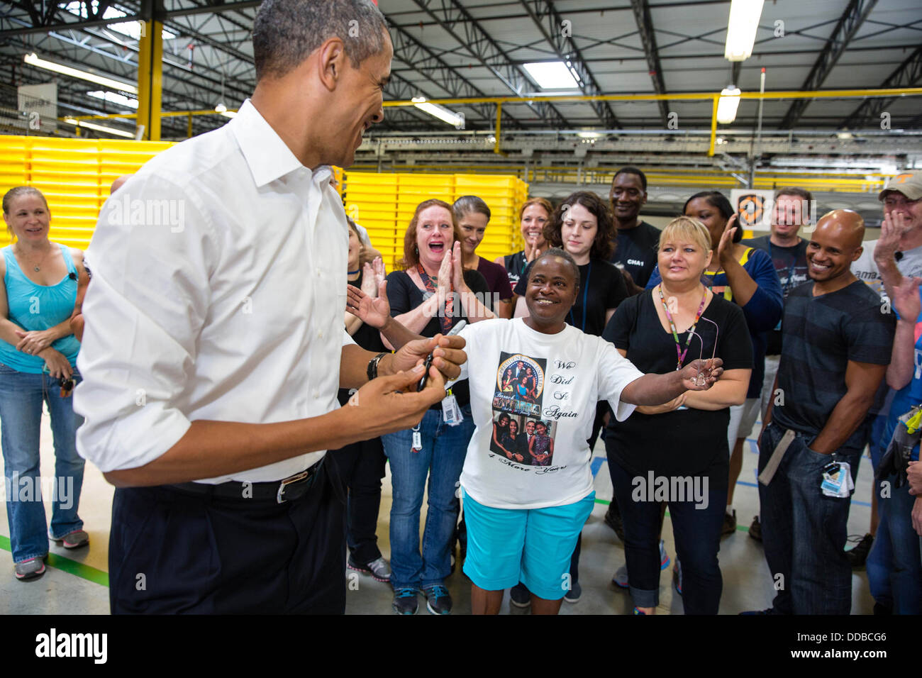 US President Barack Obama greets line workers at the Amazon fulfillment center July 30, 2013 in Chattanooga, Tennessee. Stock Photo