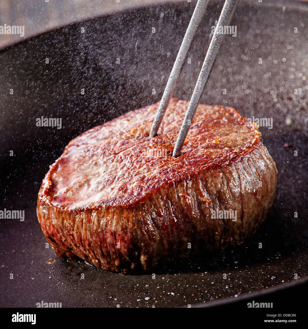 Beef steak fried in pan Stock Photo