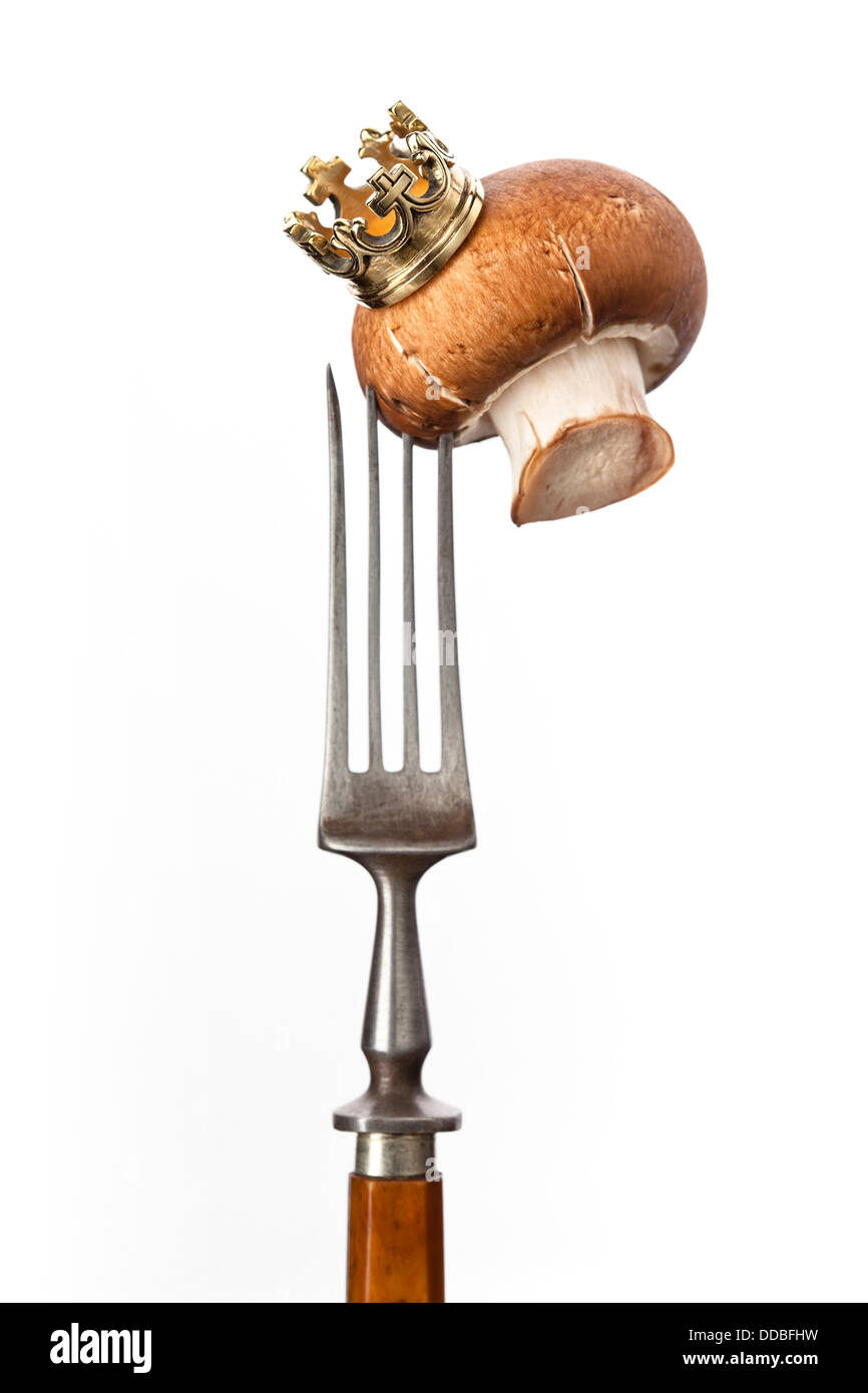 Brown champignon mushroom with crown - royal mushroom on white