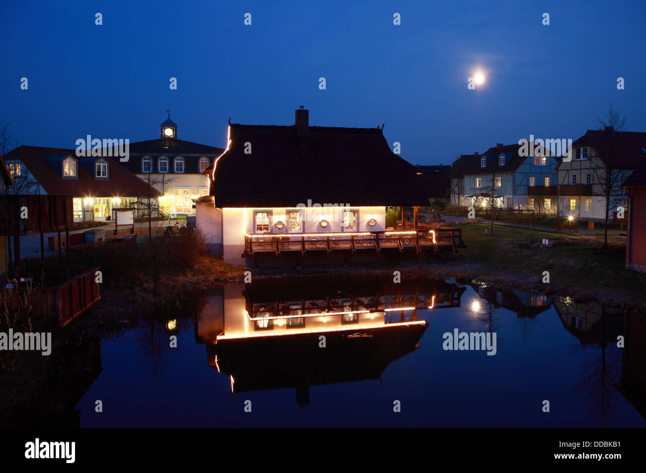 Waren, Germany, Bar Bootshus Dorfhotel Fleesensee at dusk Stock Photo