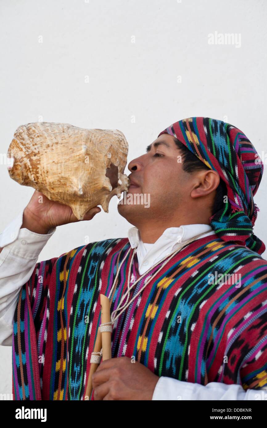 Mayan Man playing Conch Stock Photo Alamy