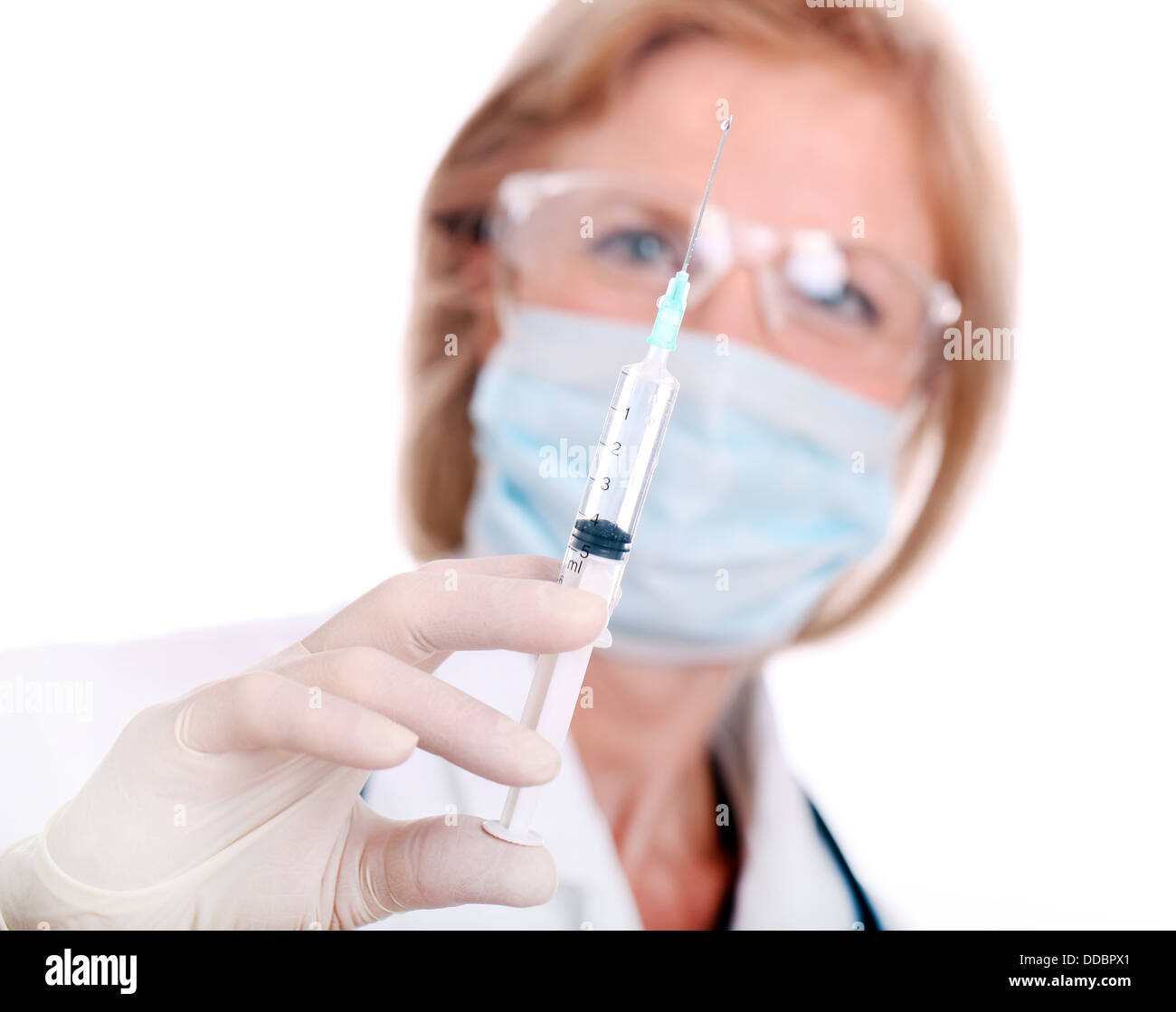 Woman doctor with syringe on a white Stock Photo - Alamy