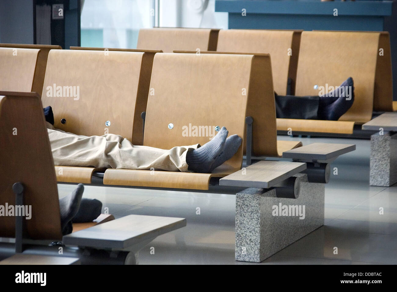 Men sleeping at airport, Incheon International Airport, South Korea
