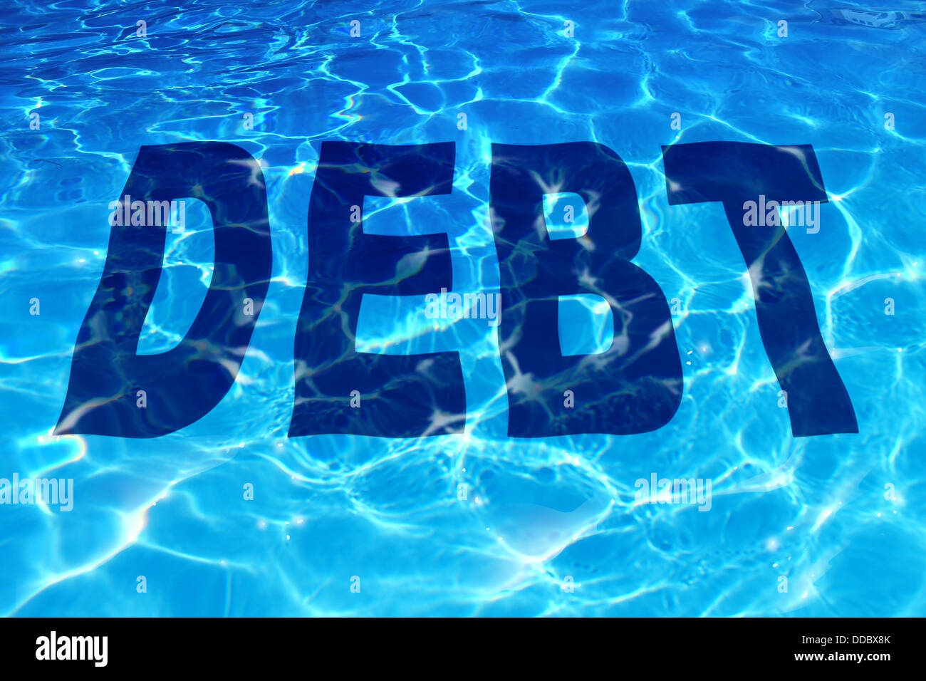 Drowning in debt business and finance concept with the word icon sinking under a sparkling reflection of blue pool of water as a Stock Photo