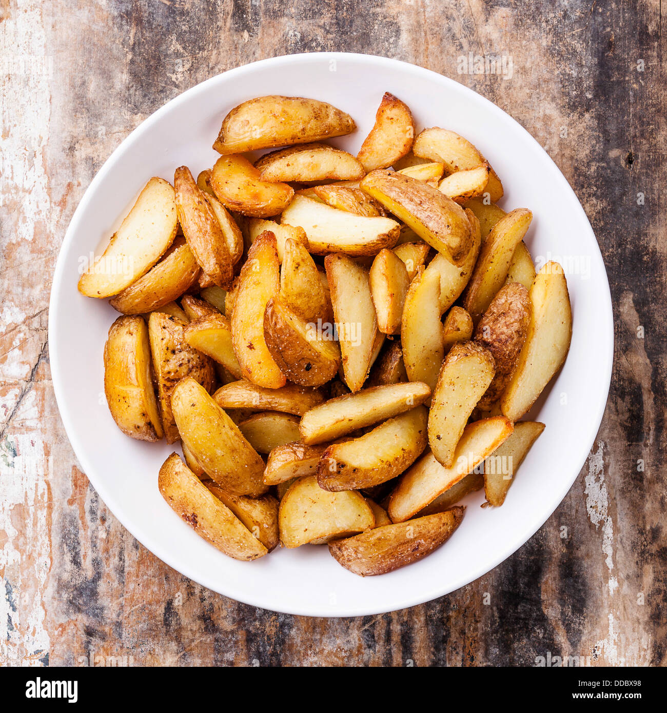 Fried potato 'country-style' on plate Stock Photo