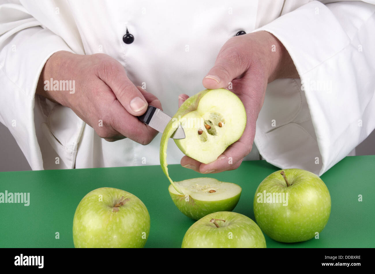 Pear Chef female chef preparing a pear Stock Photo - Alamy