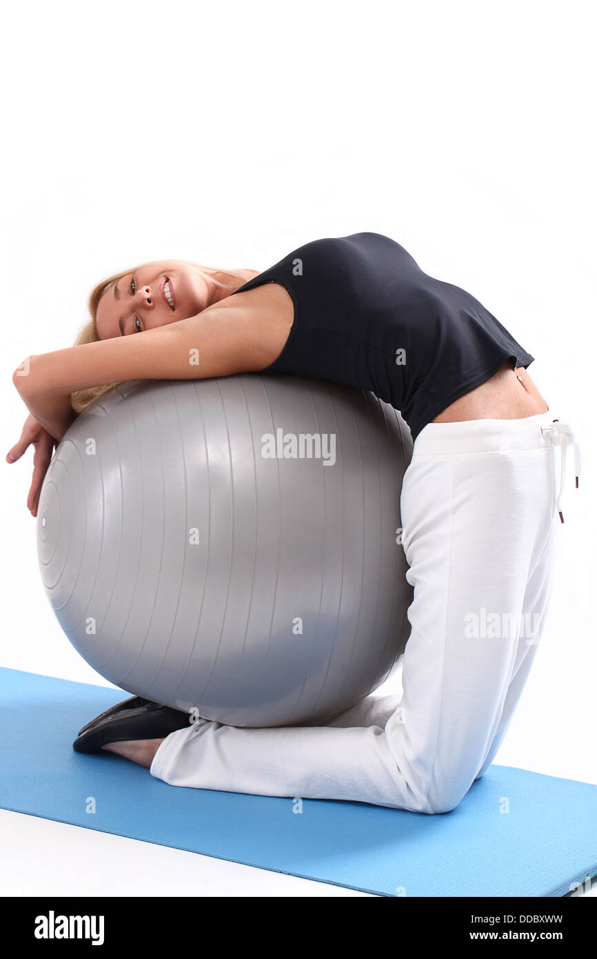 Beautiful woman doing exercise with fitness ball Stock Photo - Alamy