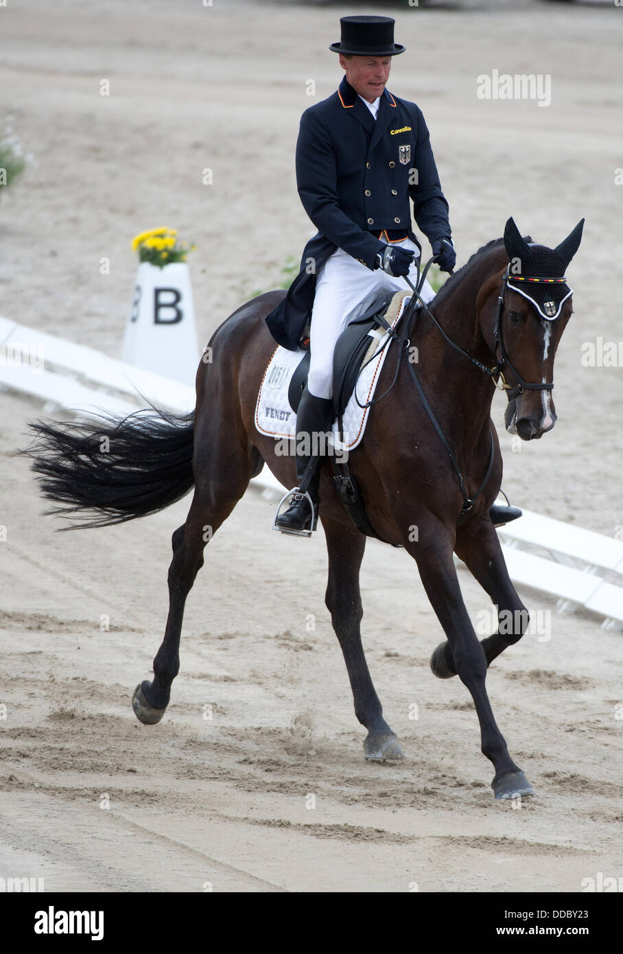 Malmoe, Sweden. 30th Aug, 2013. Eventer Michael Jung on his horse Halunke competes in the dressage event at the European Eventing Championships in Malmoe, Sweden, 30 August 2013. Photo: JOCHEN LUEBKE/dpa/Alamy Live News Stock Photo