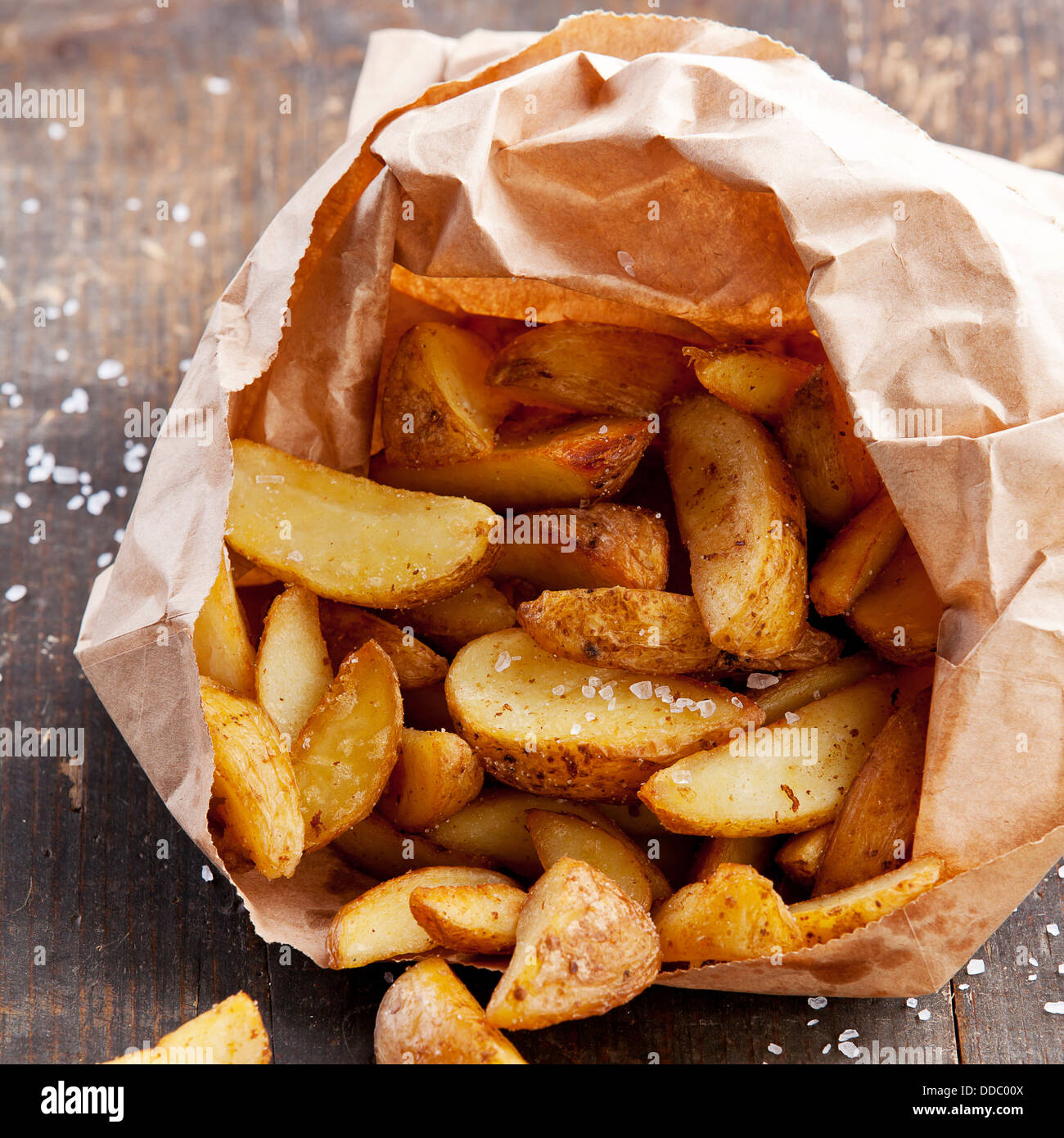 Fried potato 'country-style' in paper bag Stock Photo