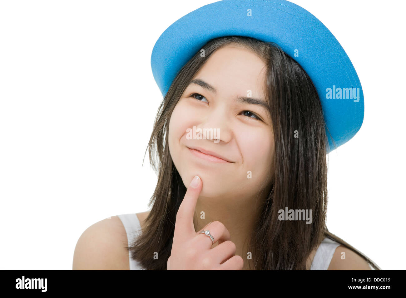 Young teenage girl in blue hat, with thoughtful expression. Isol Stock