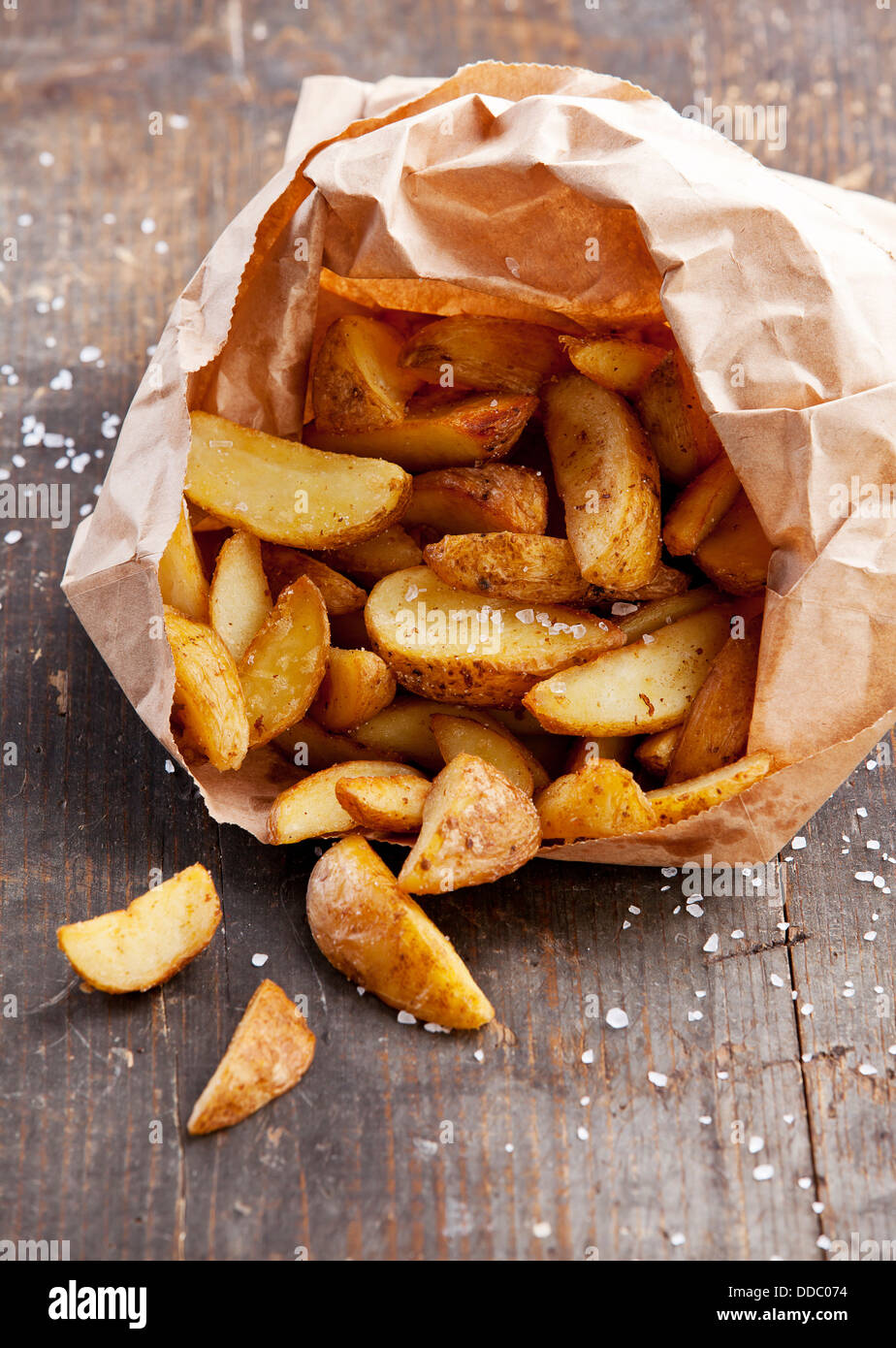Fried potato "countrystyle" in paper bag Stock Photo Alamy