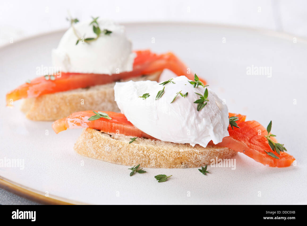 Bruschetta with poached egg and smoked salmon Stock Photo