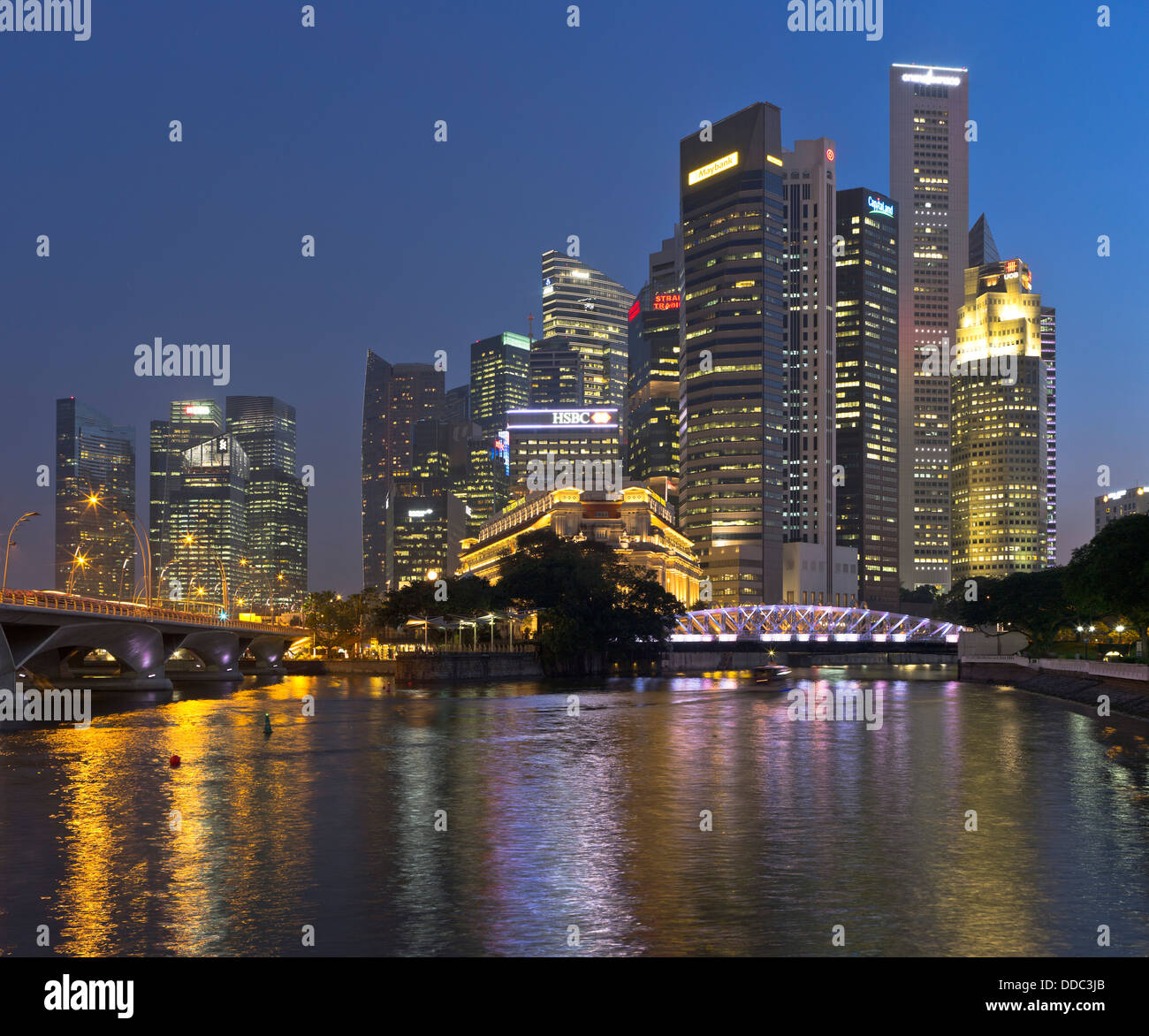 dh Singapore River skyscrapers DOWNTOWN CORE SINGAPORE Evening night lights dusk skyscraper city skyline cityscape asia tower blocks Stock Photo