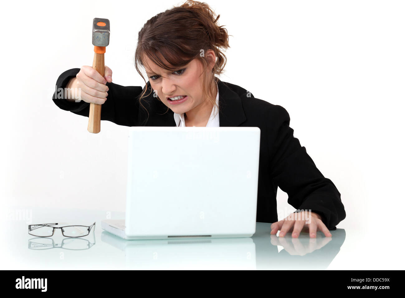 woman destroying laptop with hammer Stock Photo - Alamy
