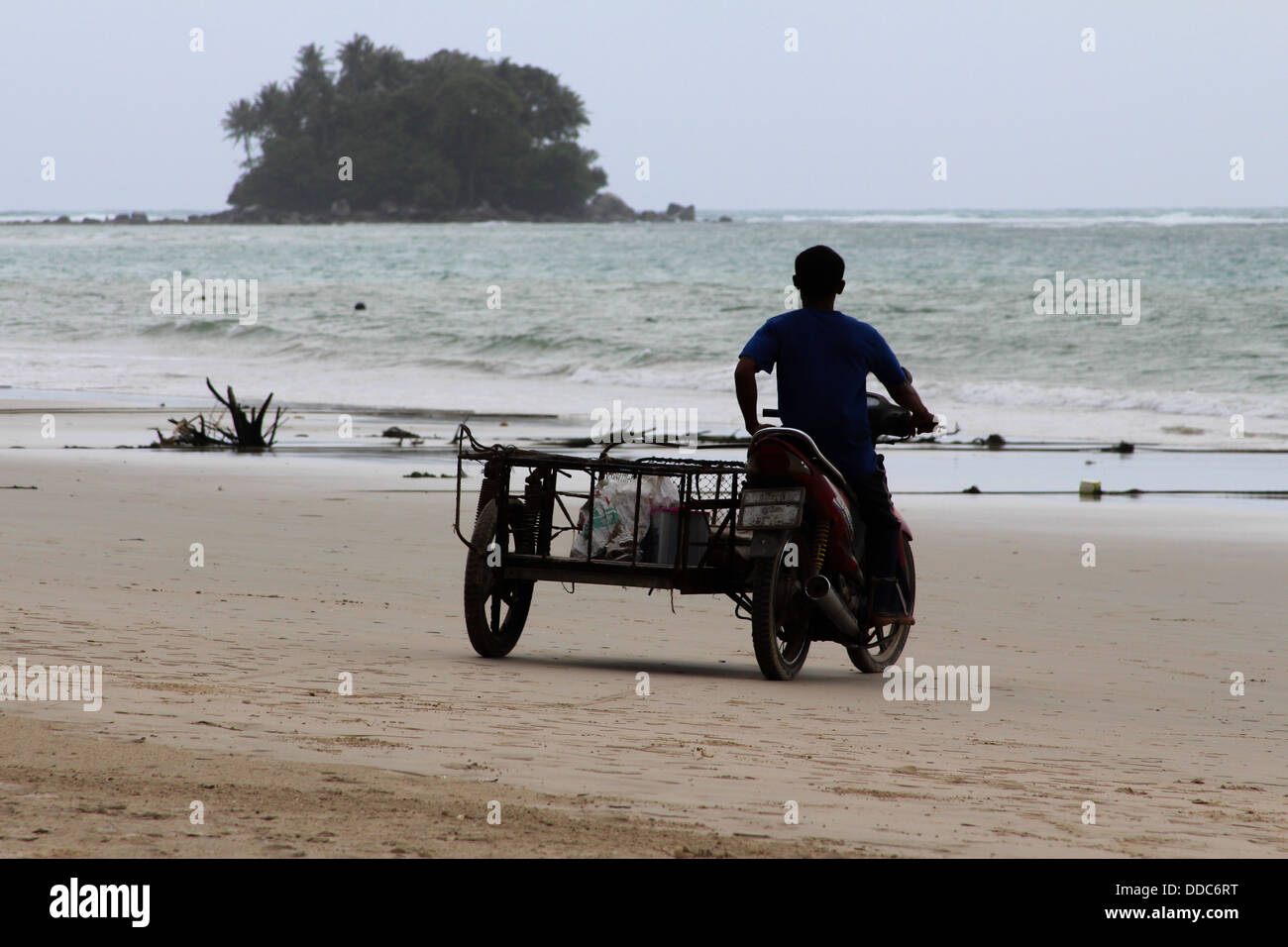 A fisherman on his way to his boat Stock Photo