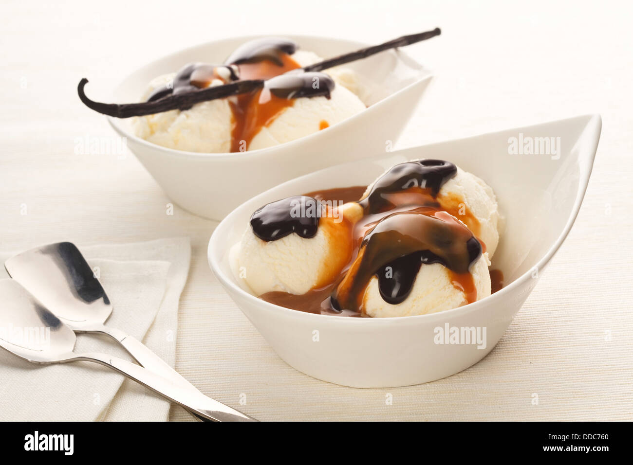 Vanilla ice cream with dark chocolate on white background Stock Photo