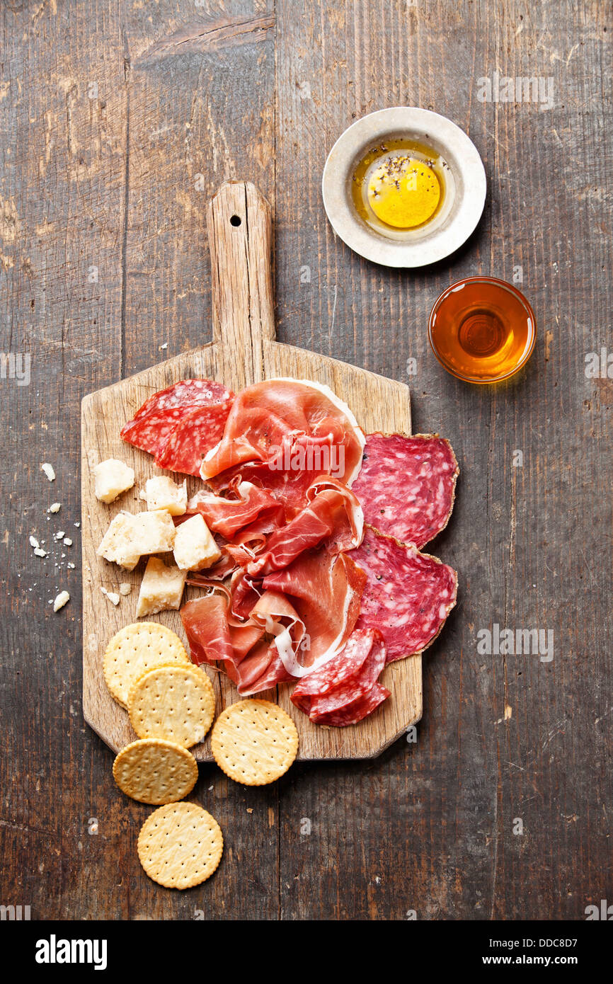 Chopping board of Assorted Cured Meats, Cheese and Honey Stock Photo