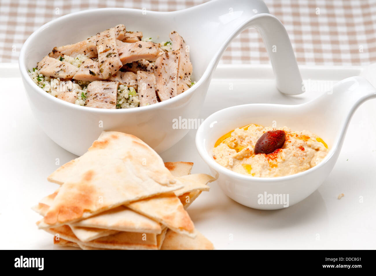 chicken taboulii couscous with hummus Stock Photo Alamy