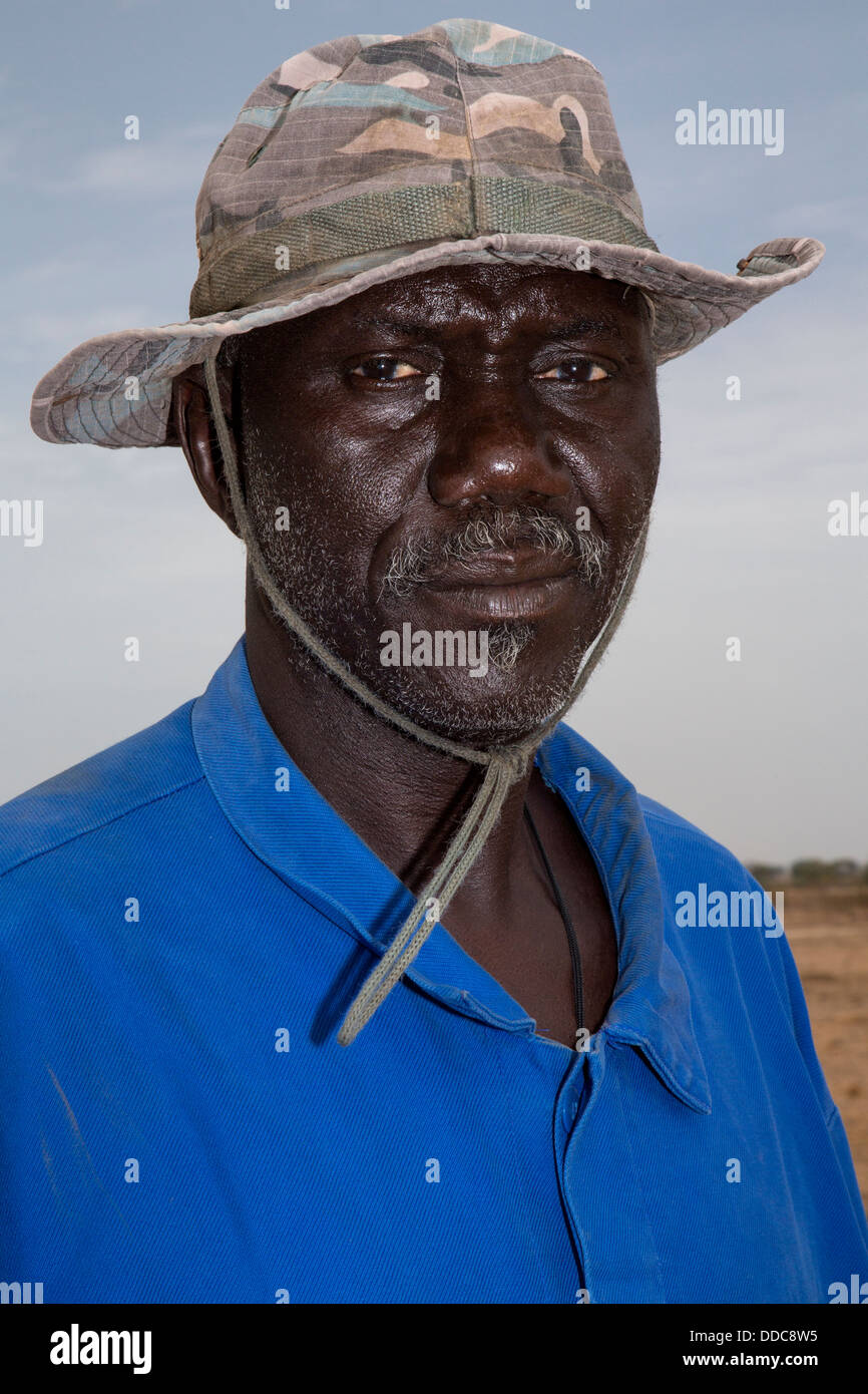 Millet Cultivation. Senior Family Member of the Family Owning the Land at this location.  Member of Serer ethnic group. Senegal. Stock Photo