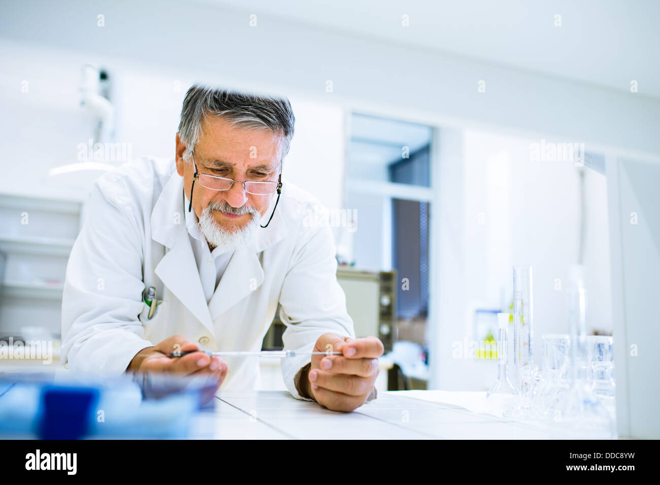 Senior male researcher carrying out scientific research in a lab Stock Photo Alamy