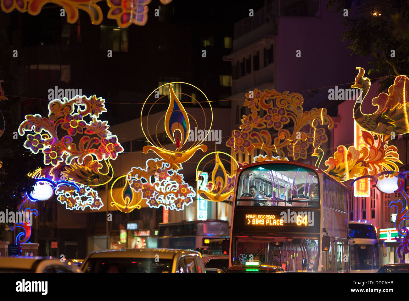 A bus drives through decorated streets celebrate the Hindi festival of Diwali or Deepavali the Asian city state of Singapore Stock Photo