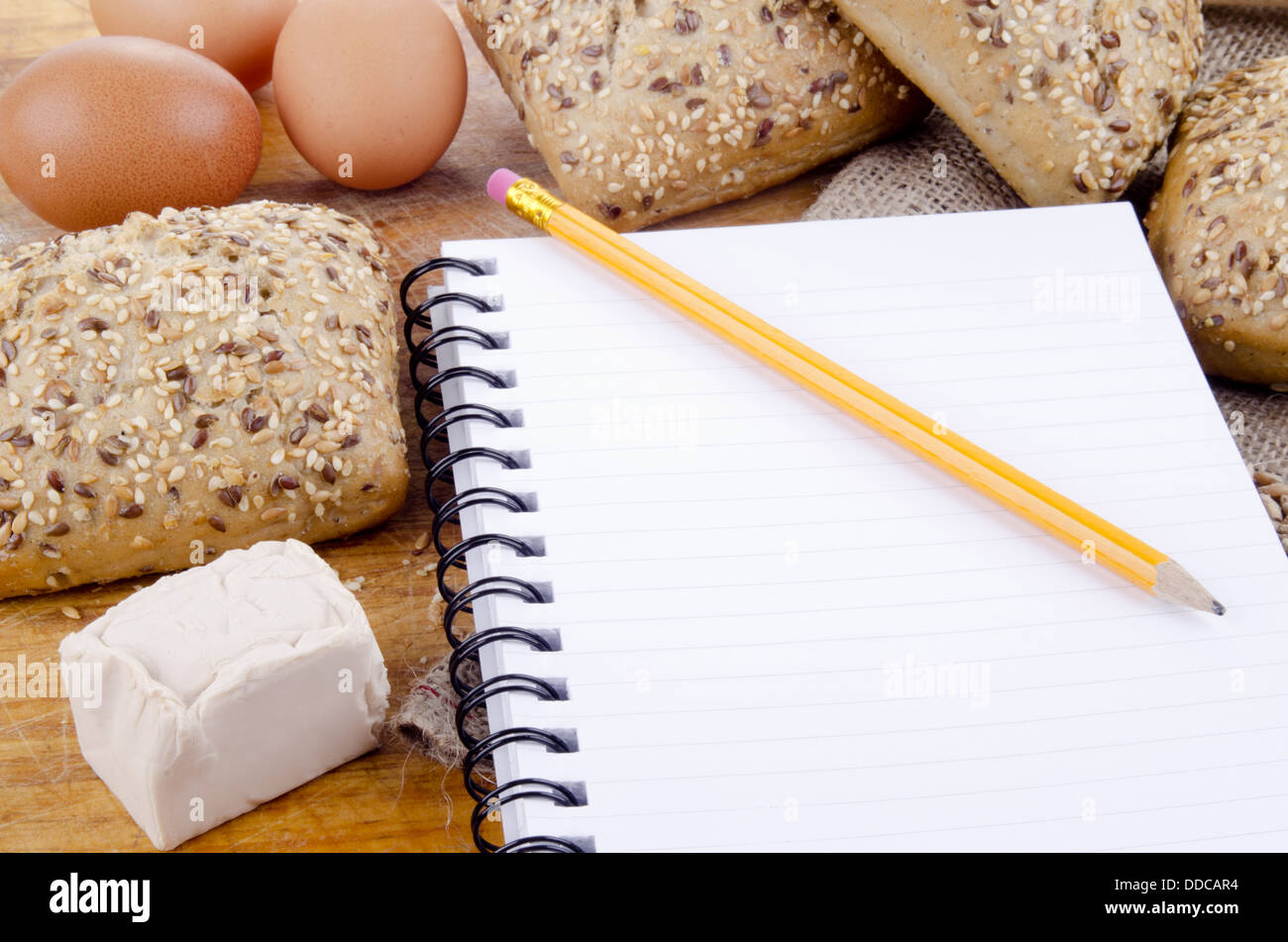 french roll and a booklet for notes Stock Photo