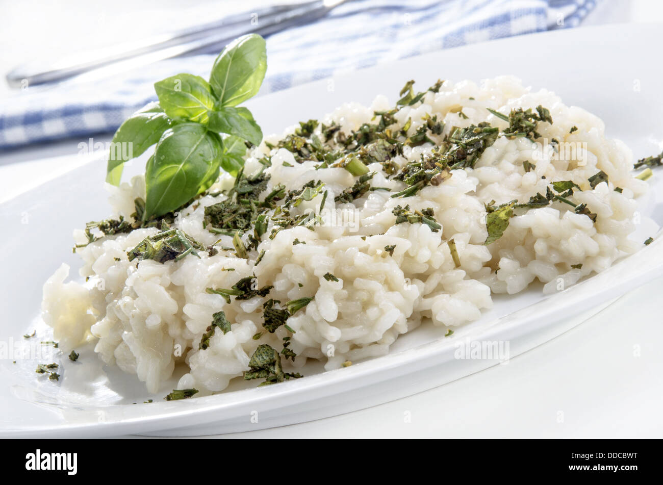 risotto rice with freshly chopped garden herbs Stock Photo Alamy