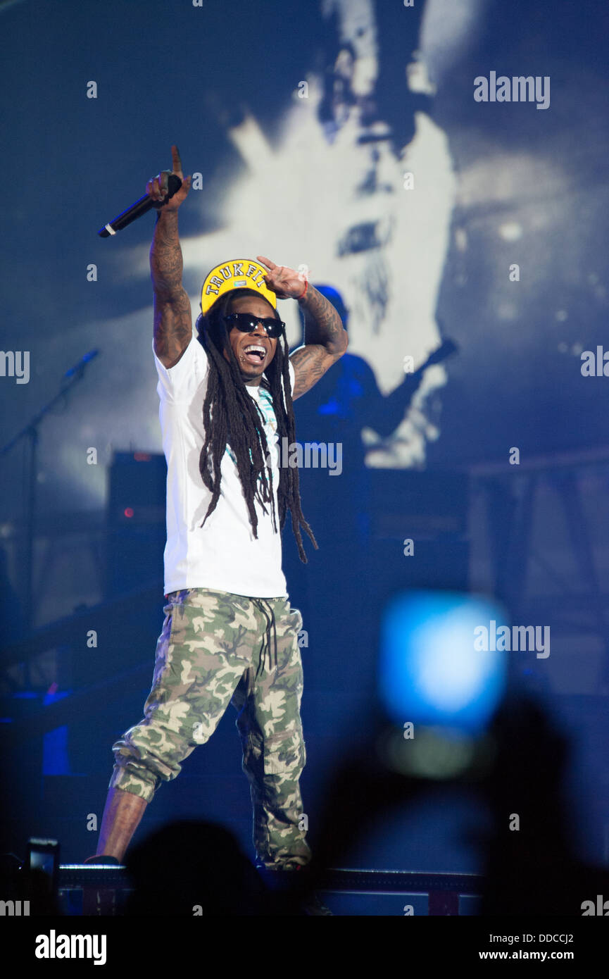 SACRAMENTO, CA - AUGUST 28: Rapper Dwayne Michael Carter, Jr. aka Lil Wayne performs in concert as part of America's Most Wanted Tour at Sleep Train Arena on August 28, 2013 in Sacramento, California. Stock Photo