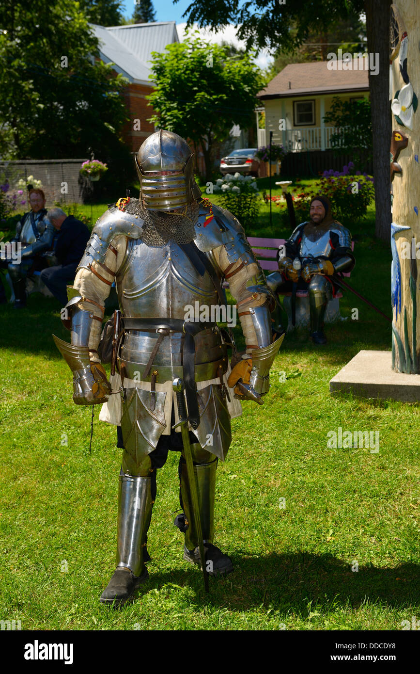Three male knights in suits of shining armor for the steampunk festival in Coldwater Ontario Canada Stock Photo