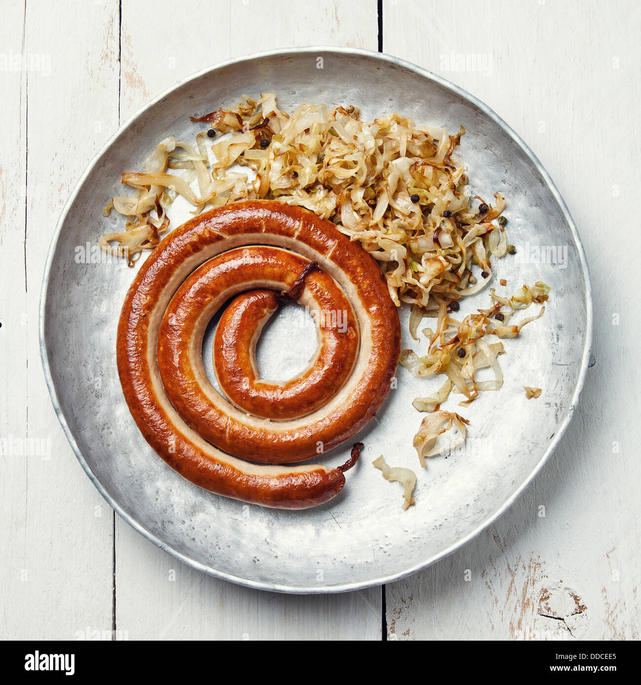 Roasted sausage with stewed cabbage Stock Photo