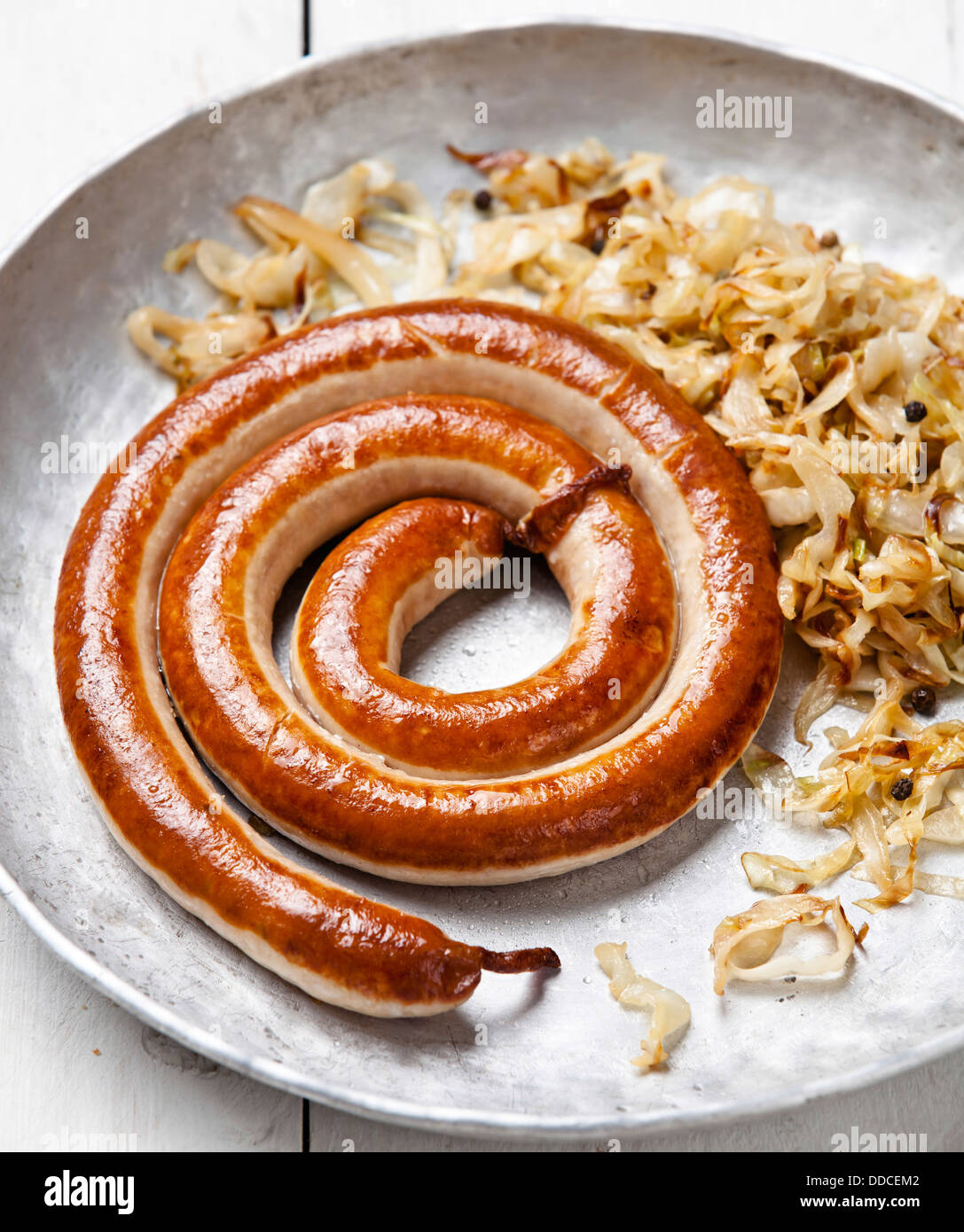 Roasted sausage with stewed cabbage Stock Photo Alamy