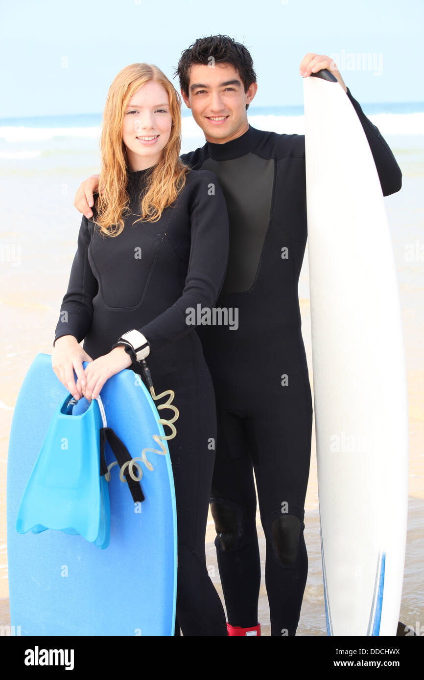 Couple wearing wetsuits Stock Photo Alamy