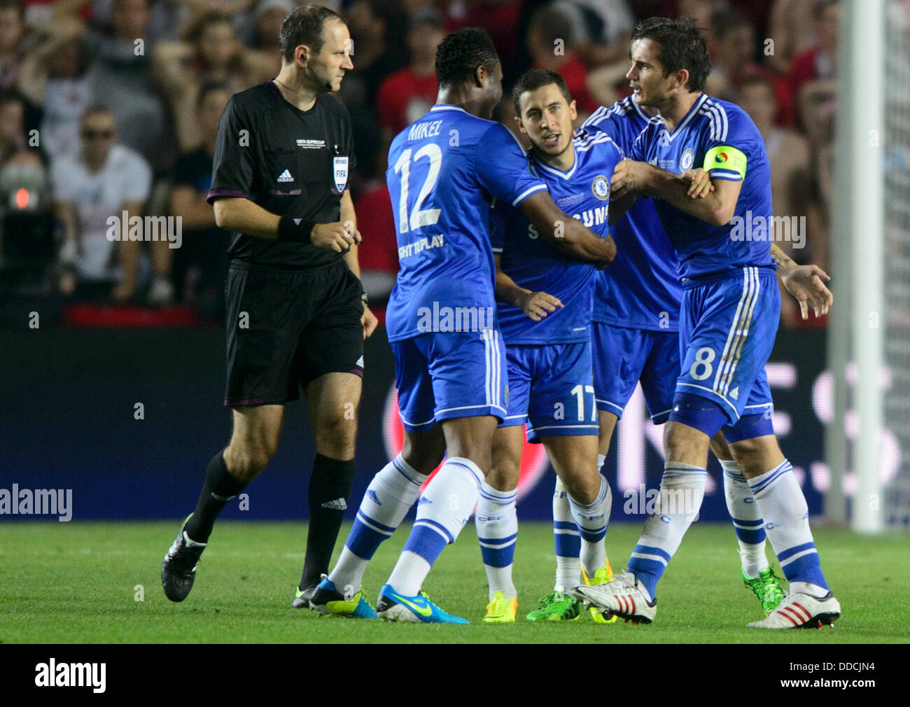Super Cup soccer match FC Chelsea vs FC Bayern Munich, Prague, Czech Republic, August 30, 2013. Eden Hazard of Chelsea receives congratulations to a goal from his teammates, pictured left John Obi Mikel, pictured right Frank Lampard. (CTK Photo/Michal Kamaryt) Stock Photo