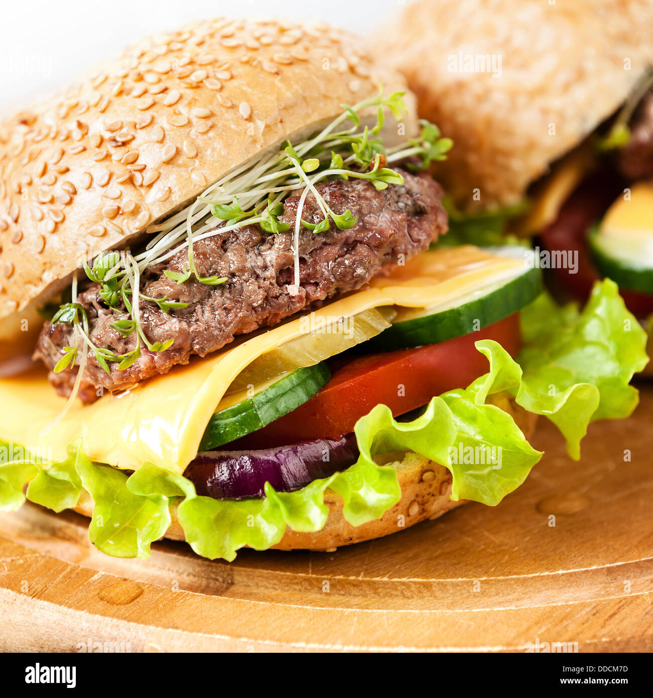 Two burgers with meat and greens Stock Photo Alamy