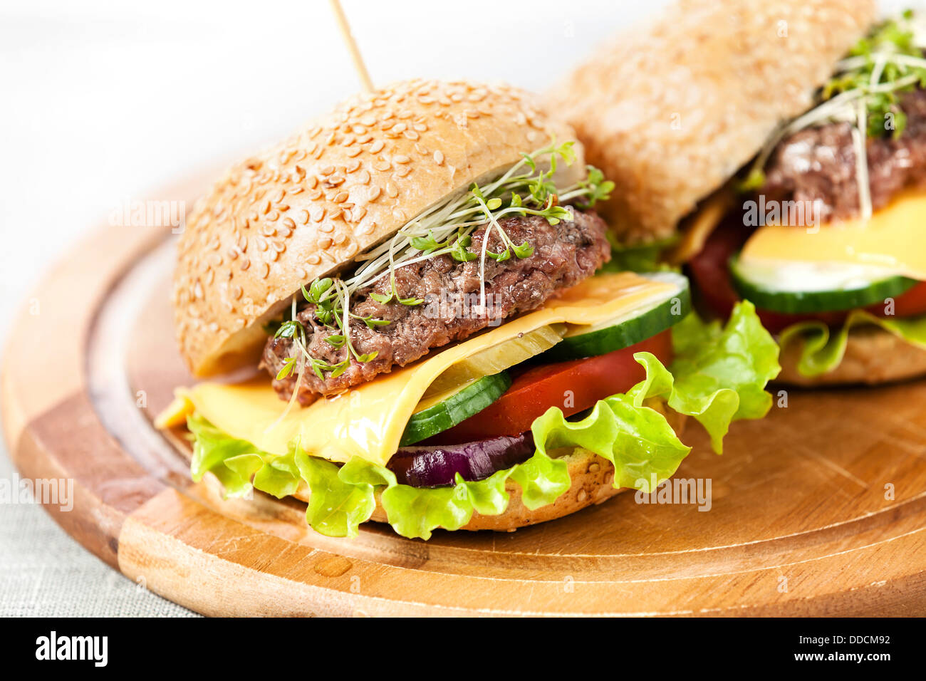 Two burgers with meat and greens Stock Photo